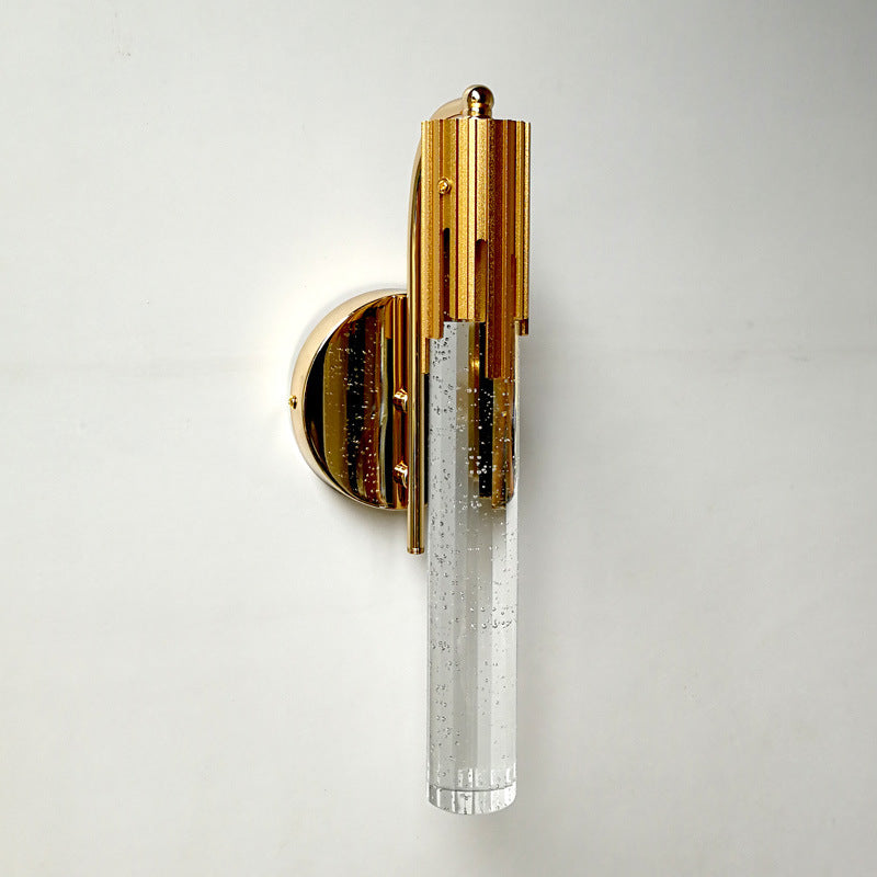 Gold and crystal wall sconce on a white background