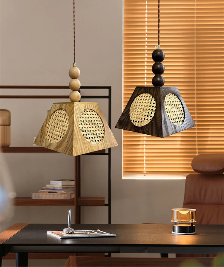 Two pendant lamps hanging above a desk with a neutral background
