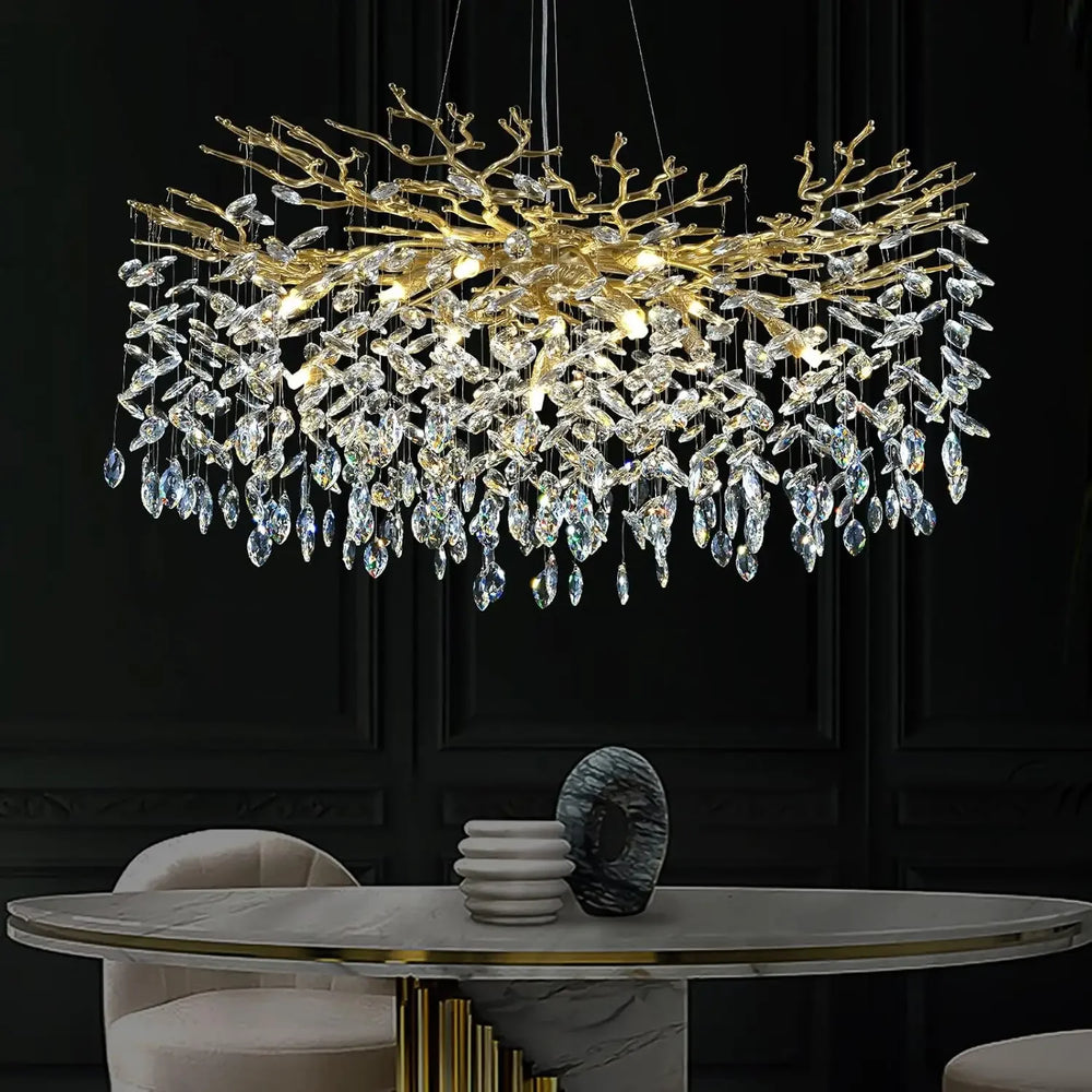 Luxurious chandelier hanging above a dining table with a dark background