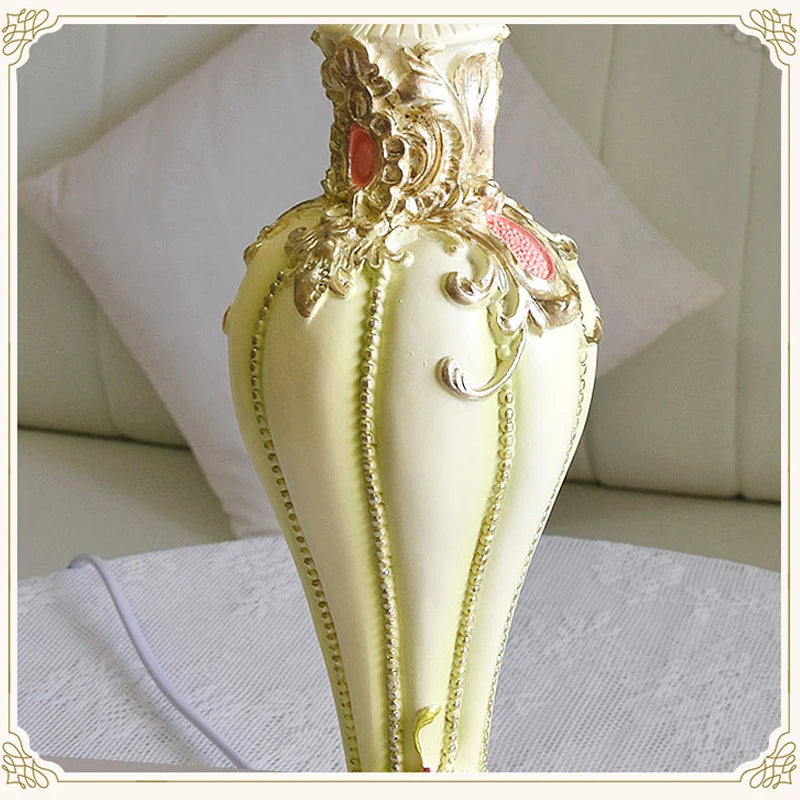 Decorative gold spoon with intricate designs on a white background