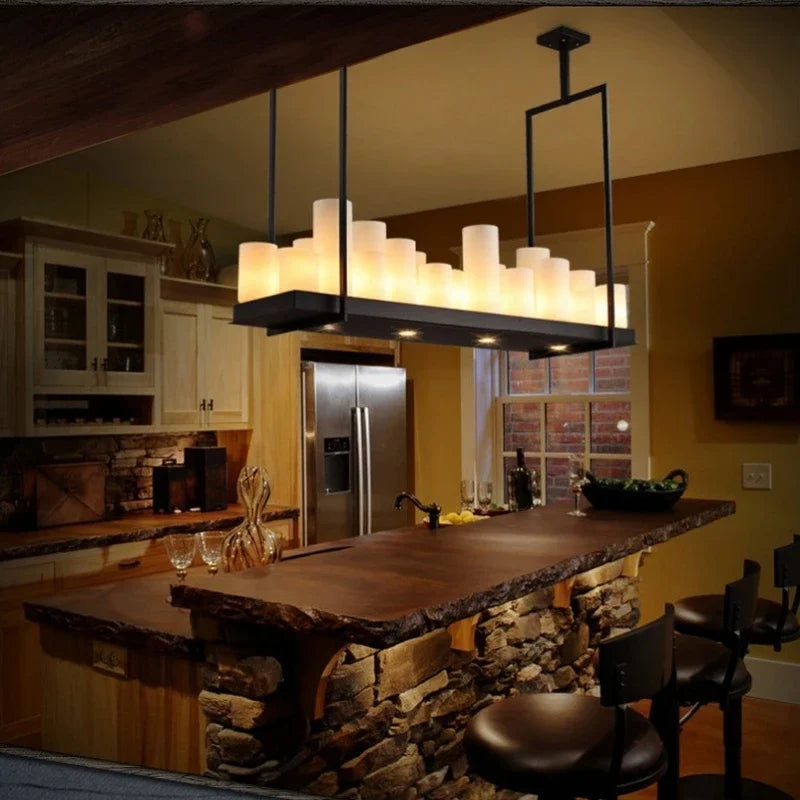 Modern kitchen with a bar area featuring a large pendant light.