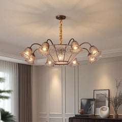 Bronze floral glass shade chandelier hanging from a ceiling.