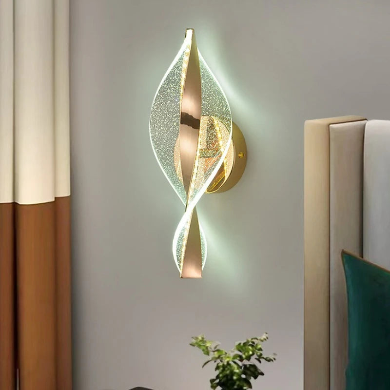 Decorative wall sconce with leaf design on a wall.