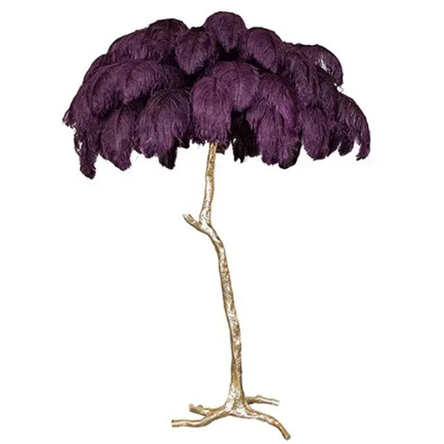 Purple feathered lamp with a gold base on a white background