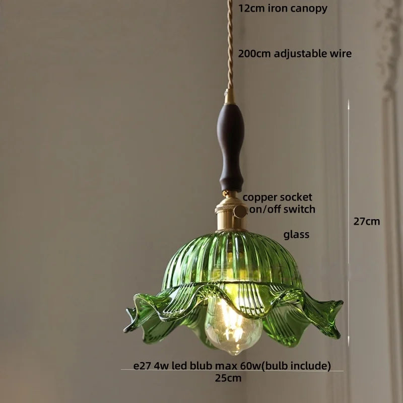 Green pendant light with measurements and details on a neutral background