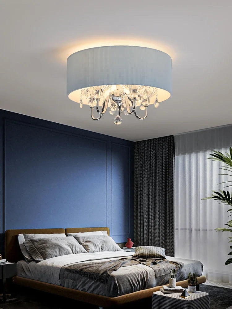 Another angle of the blue fabric drum pendant light showcasing its drum shade and crystal embellishments.