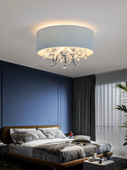 Another angle of the blue fabric drum pendant light showcasing its drum shade and crystal embellishments.