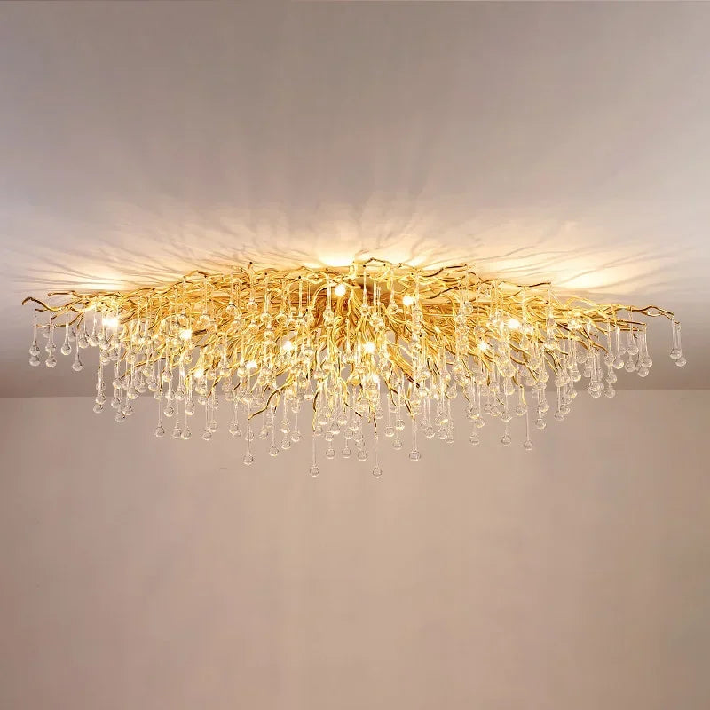 View of the gold crystal chandelier from a slightly different angle, showcasing its intricate design and sparkle.