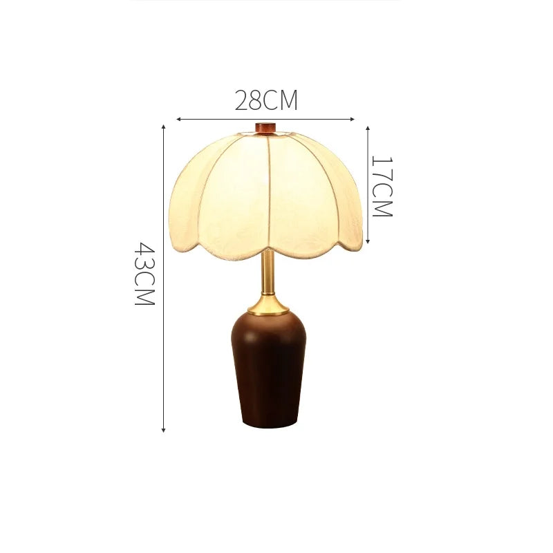 Table lamp with dimensions indicated on a white background