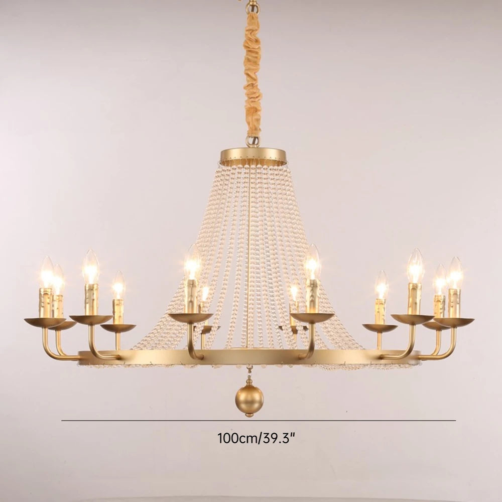 Gold chandelier with multiple candle-style lights on a plain background