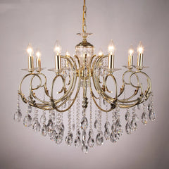 Close-up of a gold candelabra chandelier, highlighting the polished finish and intricate crystal droplets.