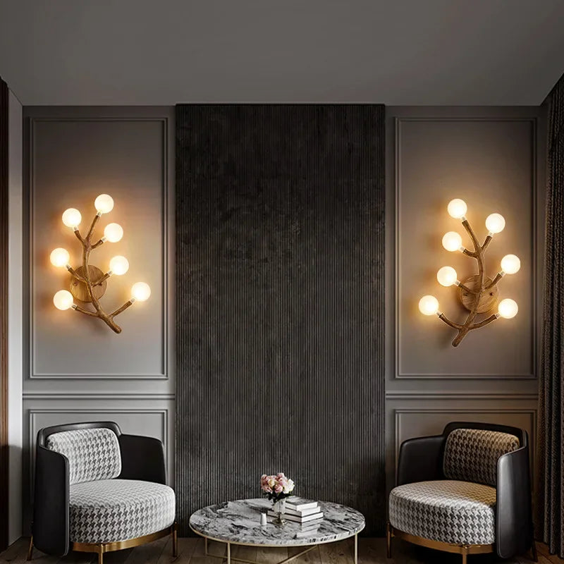 Modern interior with two armchairs and wall lights in a dark room.