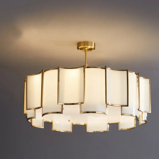 A wide shot of a gold tiered pendant light with square frosted glass shades, showcasing its circular arrangement.