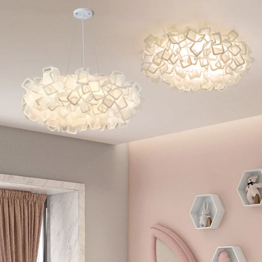 Close-up of a white petal-shaped flush mount ceiling light, showing texture.