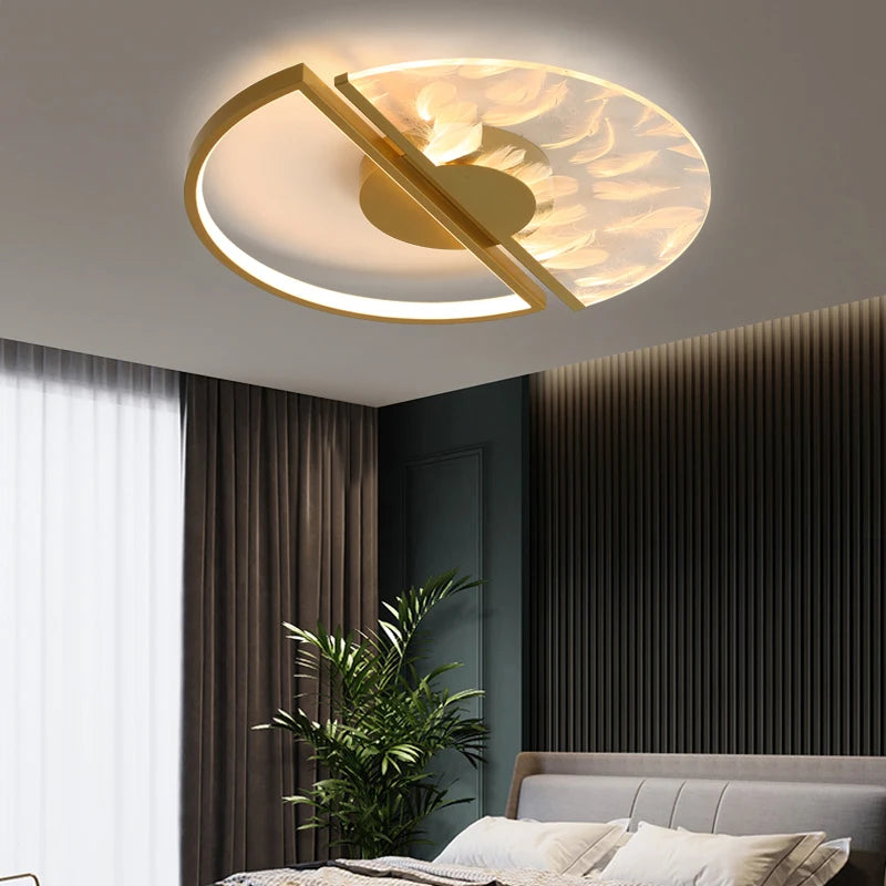 Close-up of the gold and white circular ceiling light with feather pattern glass shade.