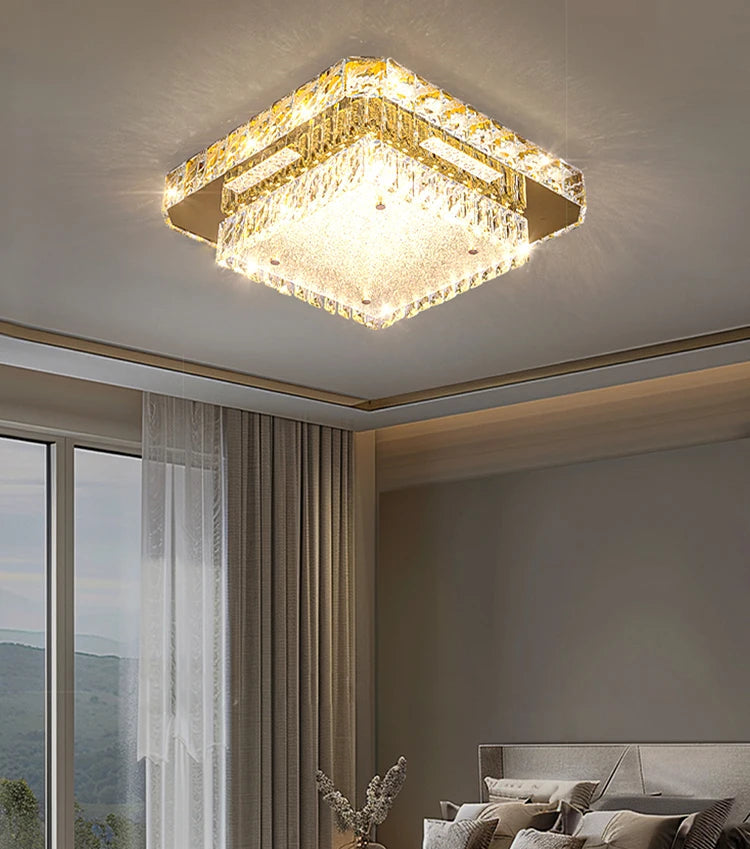 Modern ceiling light fixture in a bedroom with large windows and a bed.