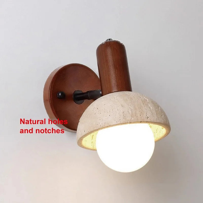 Detailed view of the stone shade of the wall sconce, highlighting its natural texture and imperfections.