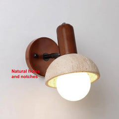 Detailed view of the stone shade of the wall sconce, highlighting its natural texture and imperfections.