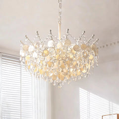 Close-up view of the gold chandelier frame and crystal droplets, showcasing the intricate design and reflective surfaces.