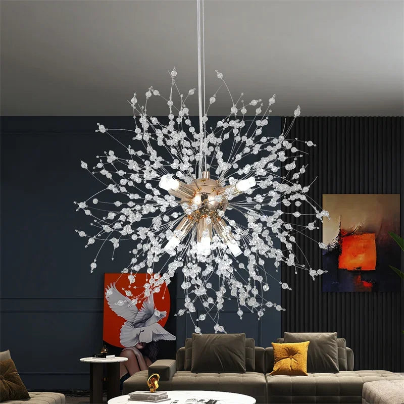 Modern chandelier hanging in a living room with dark walls and a gray sofa.