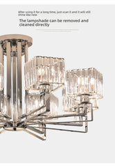 Detailed shot of the crystal shades and polished chrome arms of the chandelier.