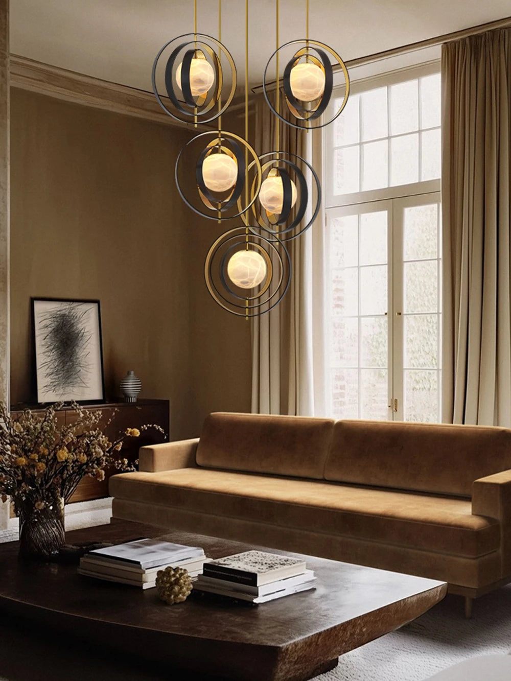 Modern living room with a stylish chandelier, brown sofa, and large window.