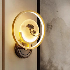 Decorative wall light fixture with floral design on a neutral background