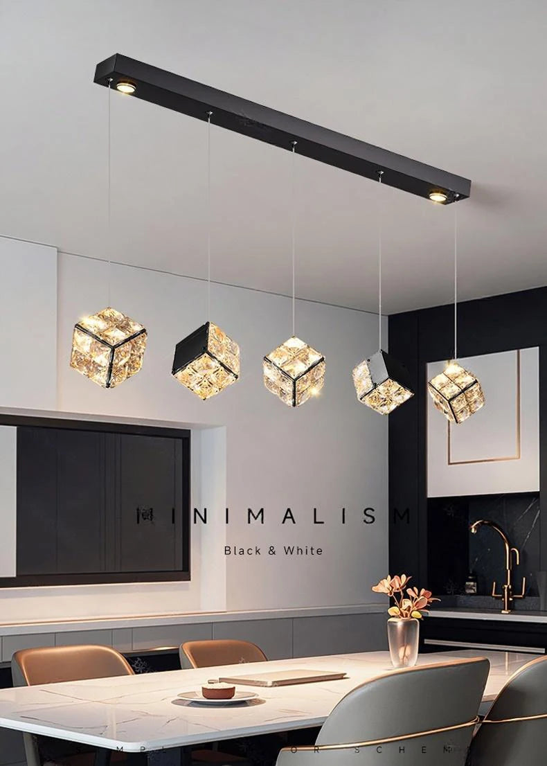 Modern kitchen with pendant lights and 'MINIMALIS Black & White' branding.