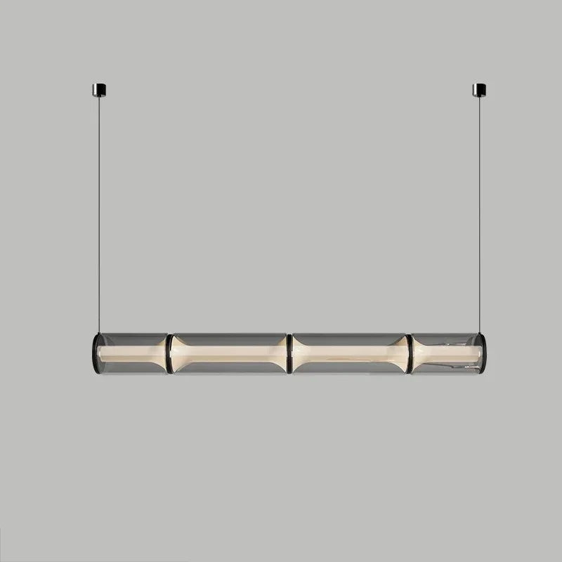 Modern pendant light with cylindrical design on a gray background