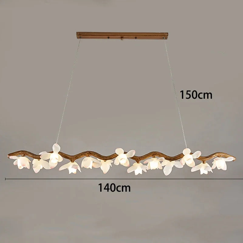 Decorative ceiling light fixture with branch-like design and floral elements, shown against a plain background.