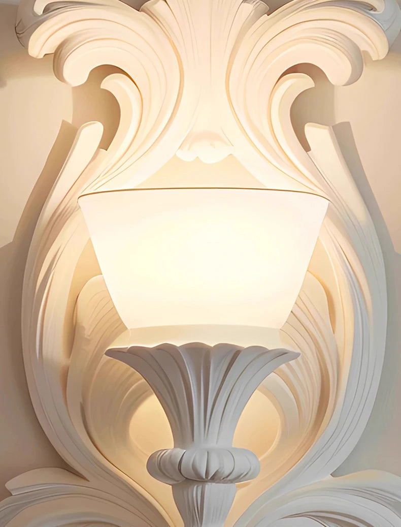 Decorative wall sconce with intricate detailing on a light background