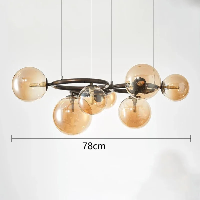 Chandelier with gold glass bulbs and metal frame on a white background, showing dimensions.