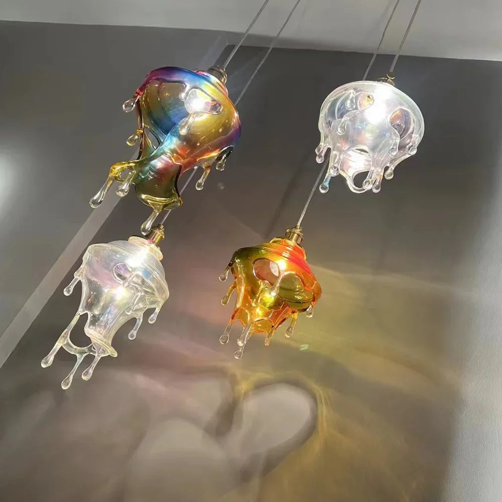 Colorful jellyfish-shaped lamps hanging against a neutral background