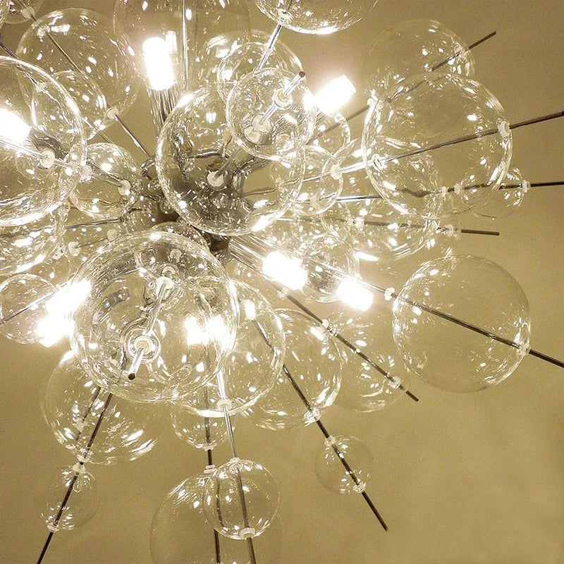 Detailed view of the glass spheres and LED lights within a starburst chandelier, highlighting the intricate construction and reflective surfaces.