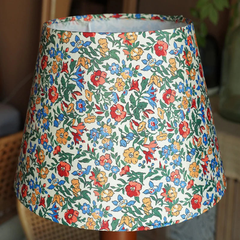 Floral patterned lampshade on a blurred background