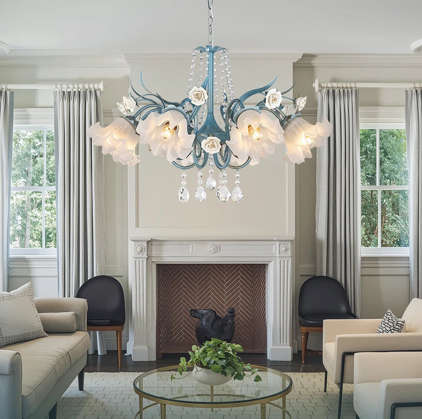 Living room with a chandelier, sofa, and fireplace, featuring the brand 'Artpad'.