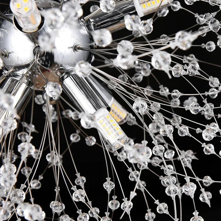 Close-up of a chandelier with crystal prisms and light bulbs on a black background