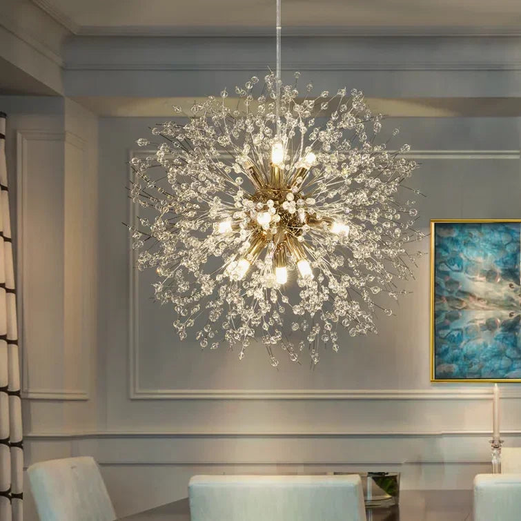 Luxury chandelier hanging in a room with a painting on the wall.