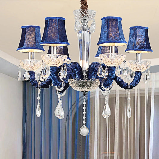 A 6-head chandelier with vibrant blue fabric shades and clear crystal accents, designed for a semi-flush mount installation.