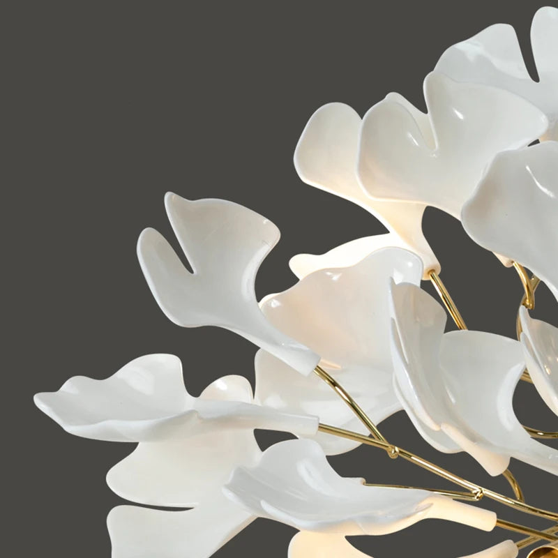 Decorative white floral light fixture on a dark background