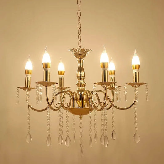 Gold tiered crystal chandelier with cascading waterfall elements and candle-style bulbs.