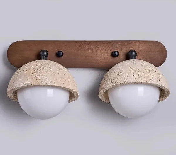 Wall-mounted light fixture with wooden bracket and ceramic lampshades on a plain background