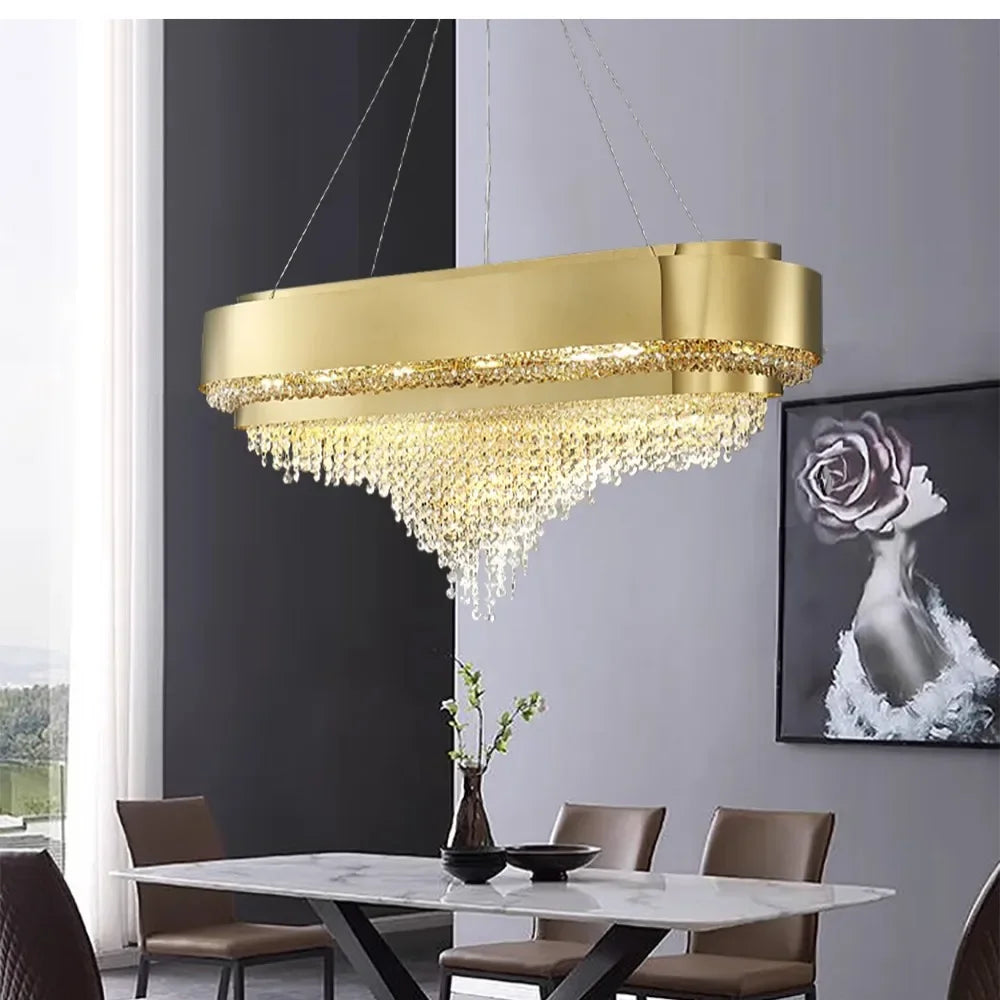 A bright and airy room featuring a gold tiered crystal chandelier as a central lighting fixture.