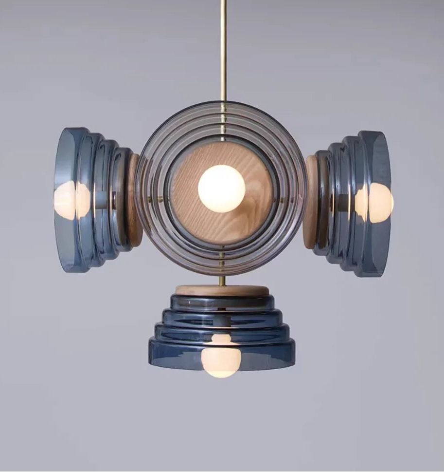 Modern pendant light with blue and wooden design on a gray background