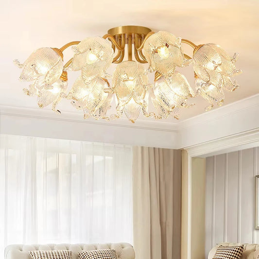 Close-up of the gold semi-flush ceiling light, showing the intricate details of the glass floral shades and polished gold frame.