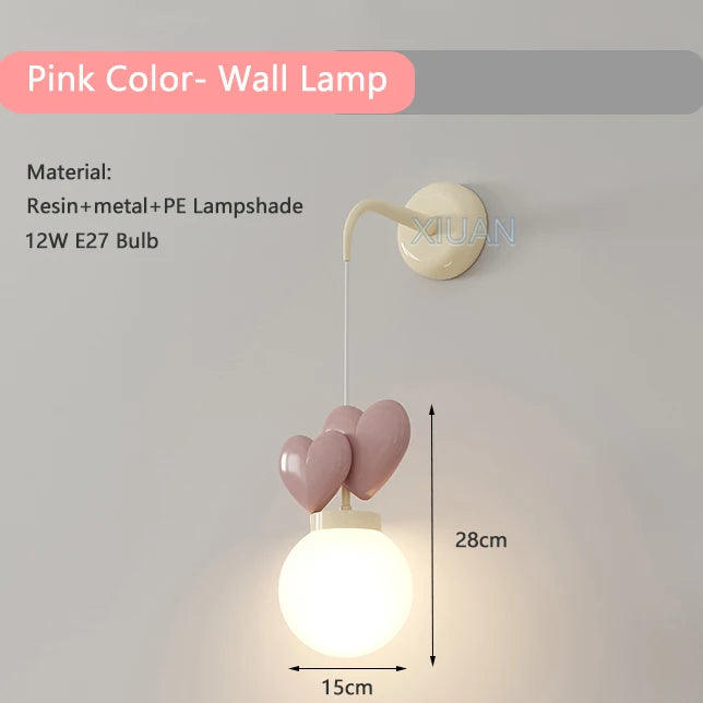 Wall lamp with pink heart-shaped design on a gray background