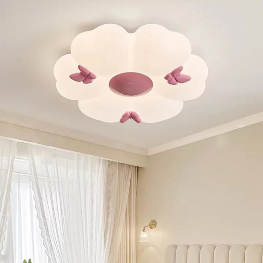 White flower cloud semi-flush mount ceiling light with pink butterflies, mounted on a white ceiling.