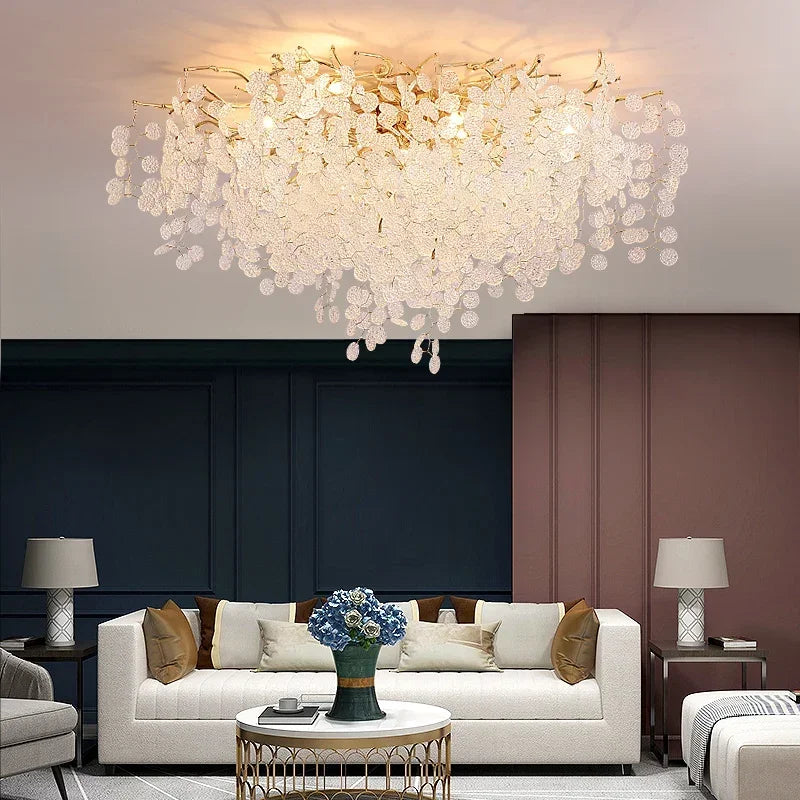 The gold cascading crystal floral chandelier displayed in a dining room setting.