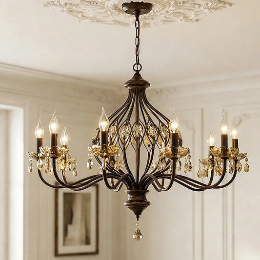 Side view of a multi-arm bronze chandelier adorned with amber crystals, suspended indoors.