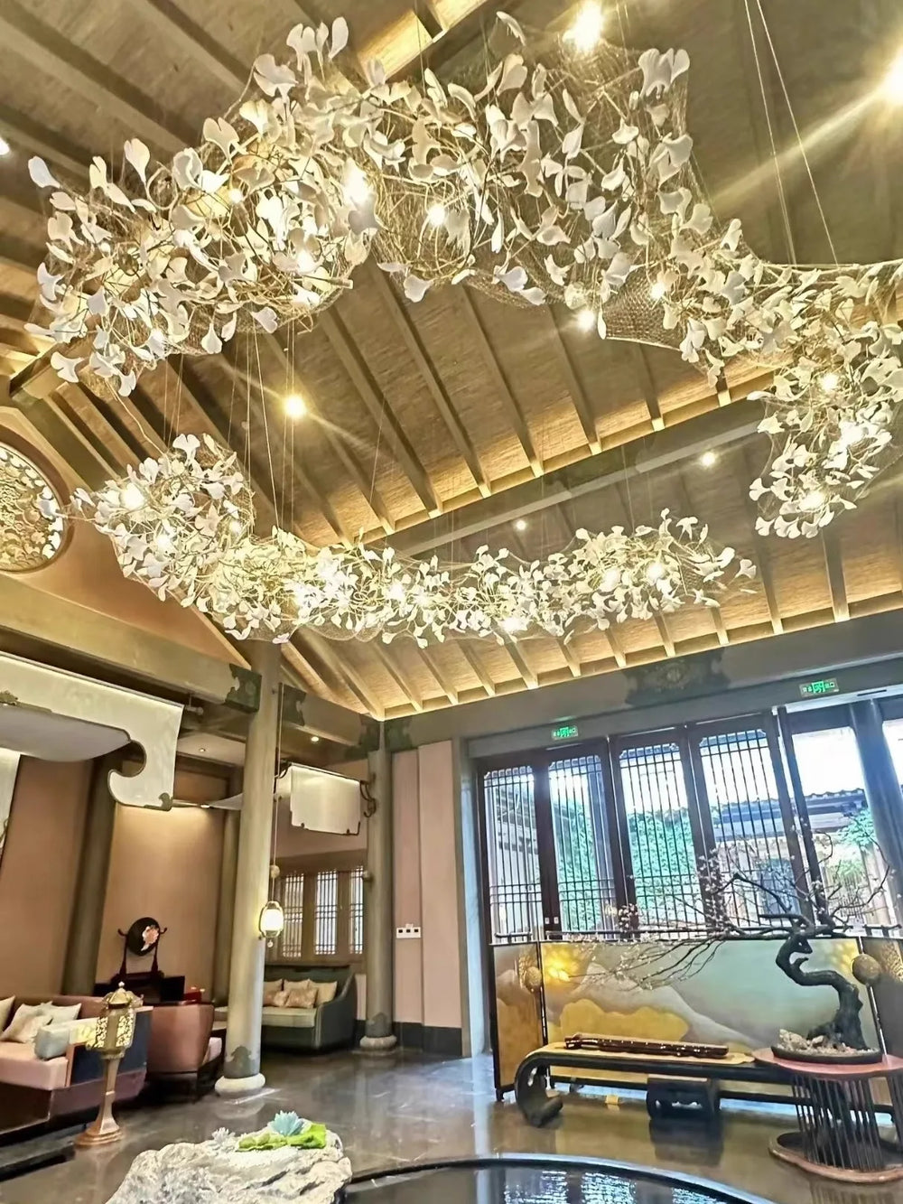 Luxurious interior with chandeliers hanging from a high ceiling